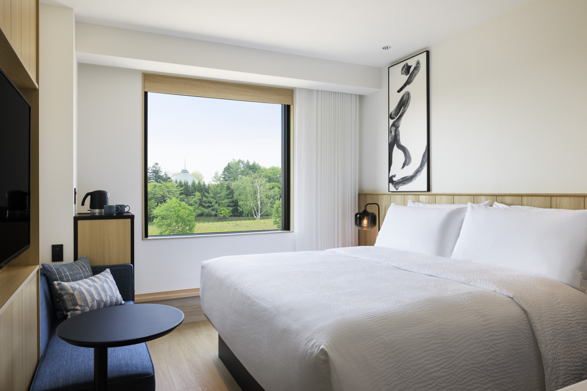 a bed with a large window