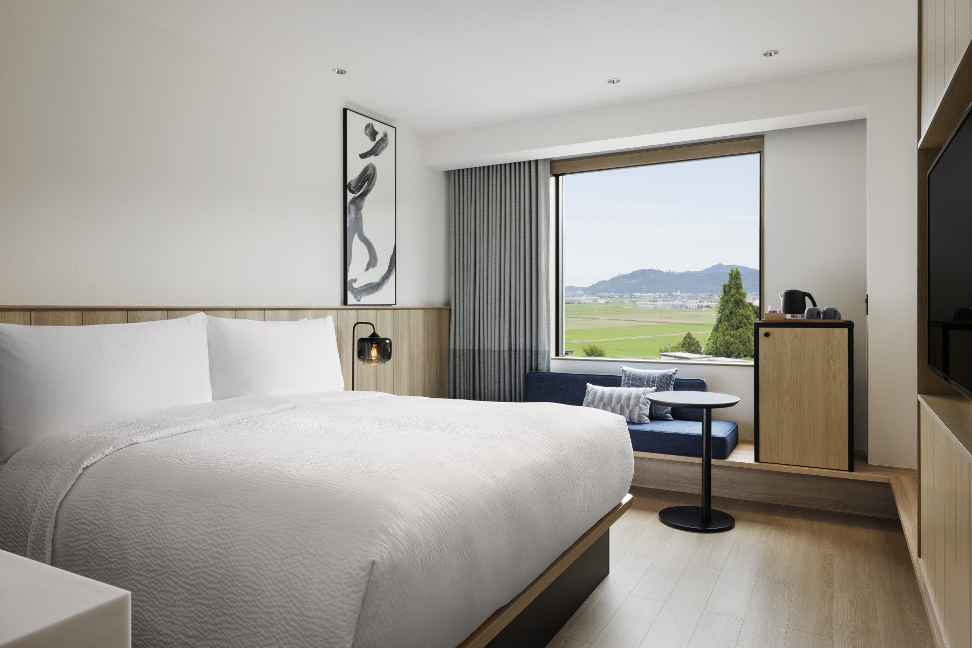a room with a bed and a window