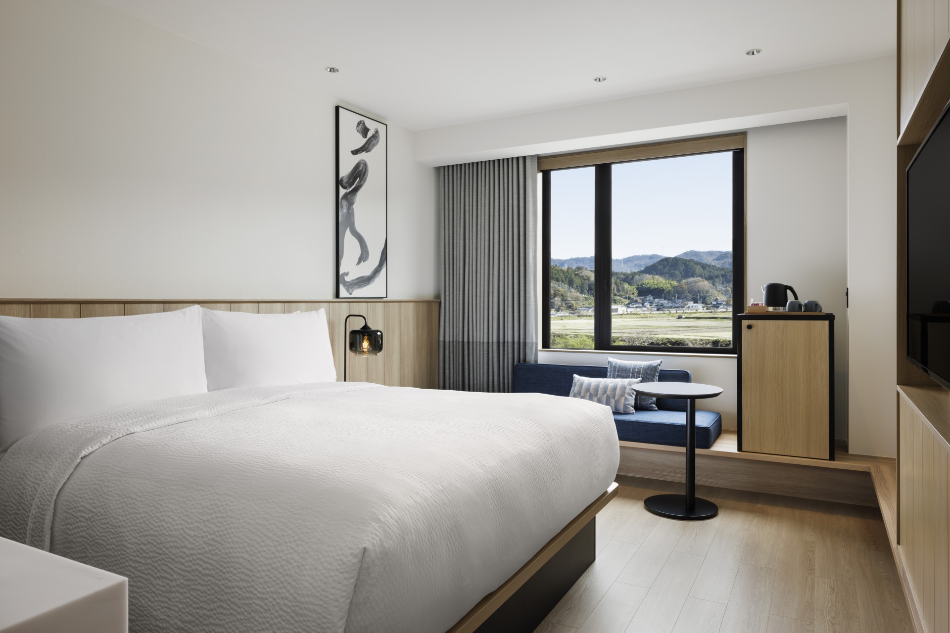 a room with a bed and a window