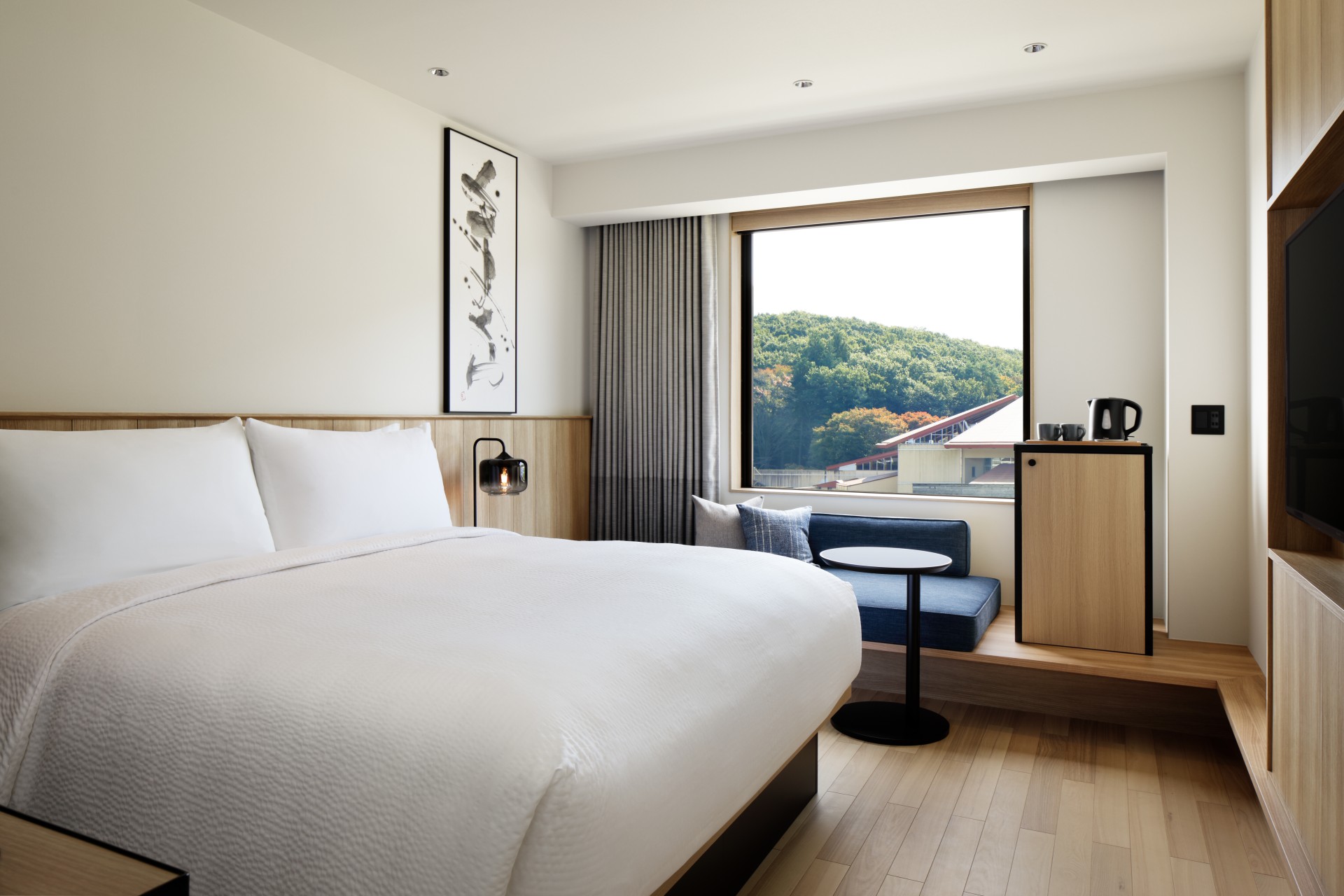 a room with a bed and a window