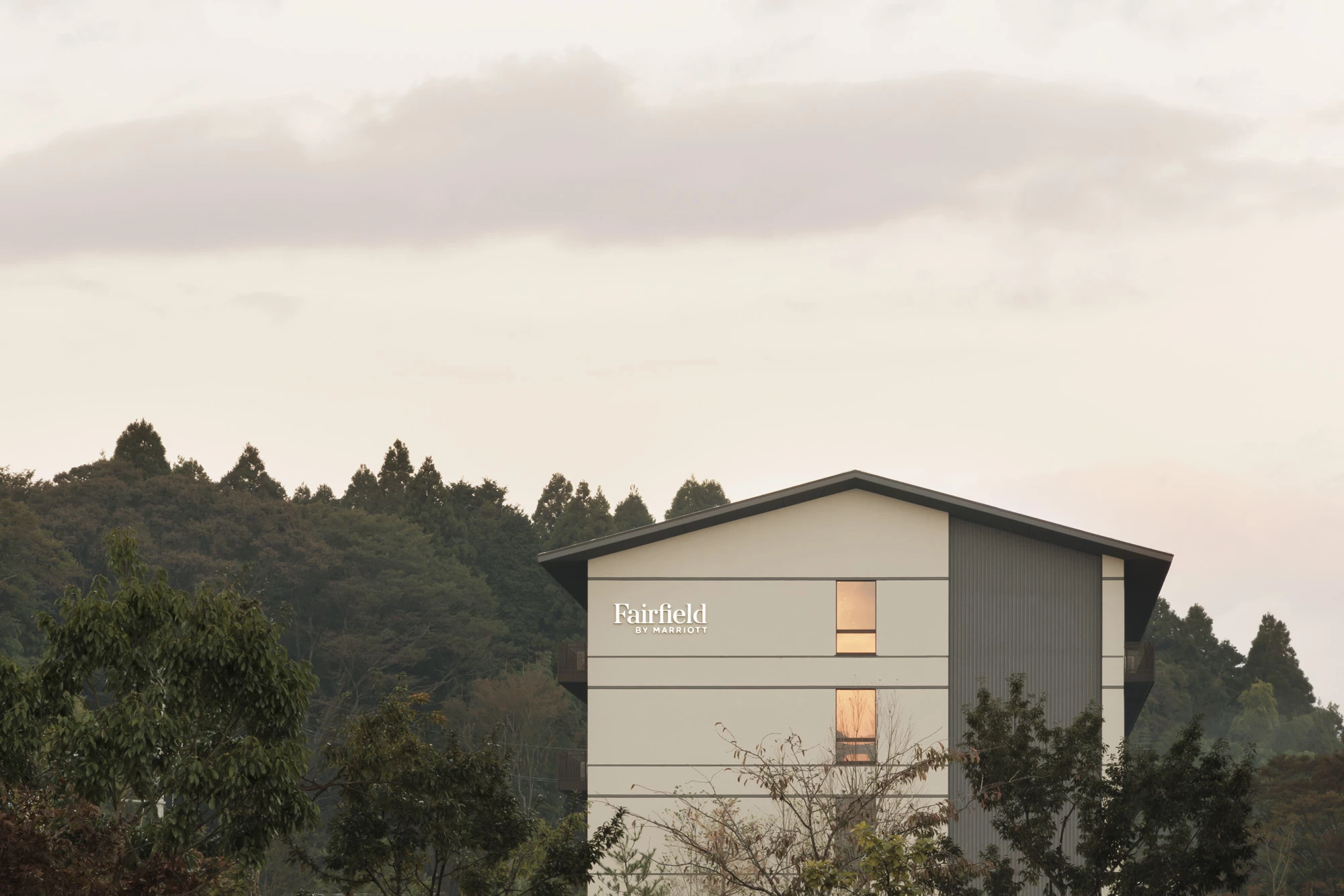 a building with trees in the background