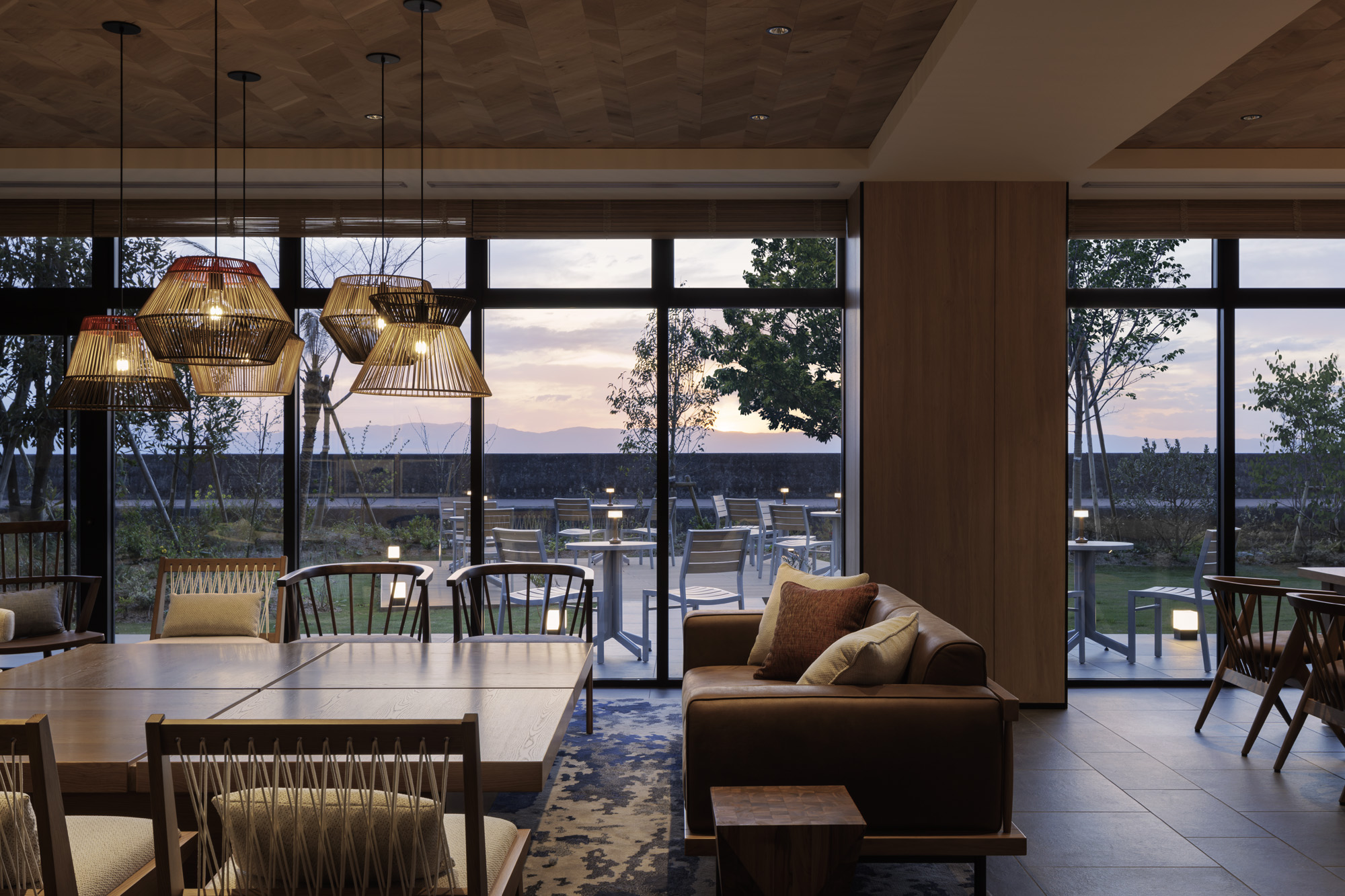 a room with a couch and chairs and a table