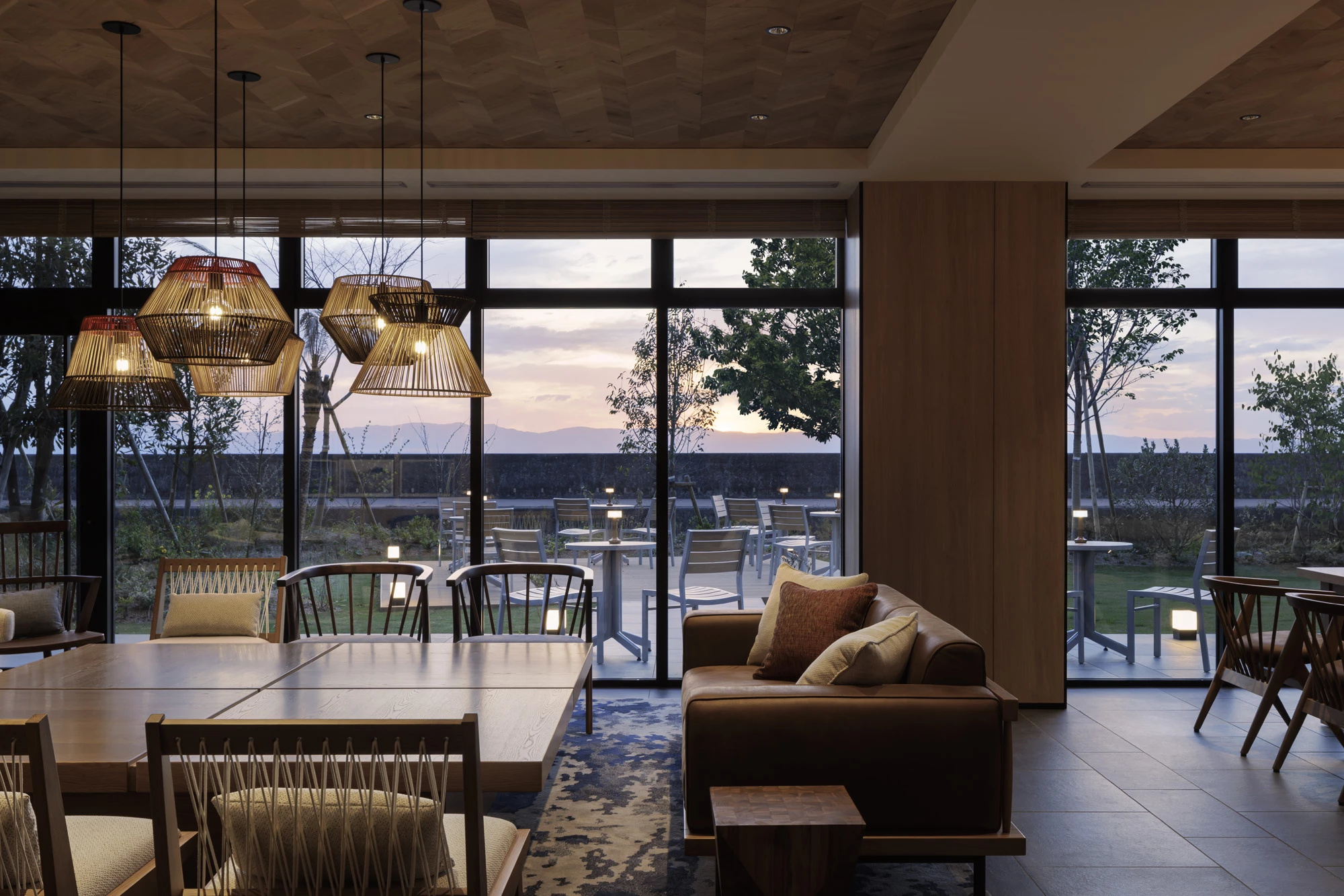 a room with a couch and chairs and a table
