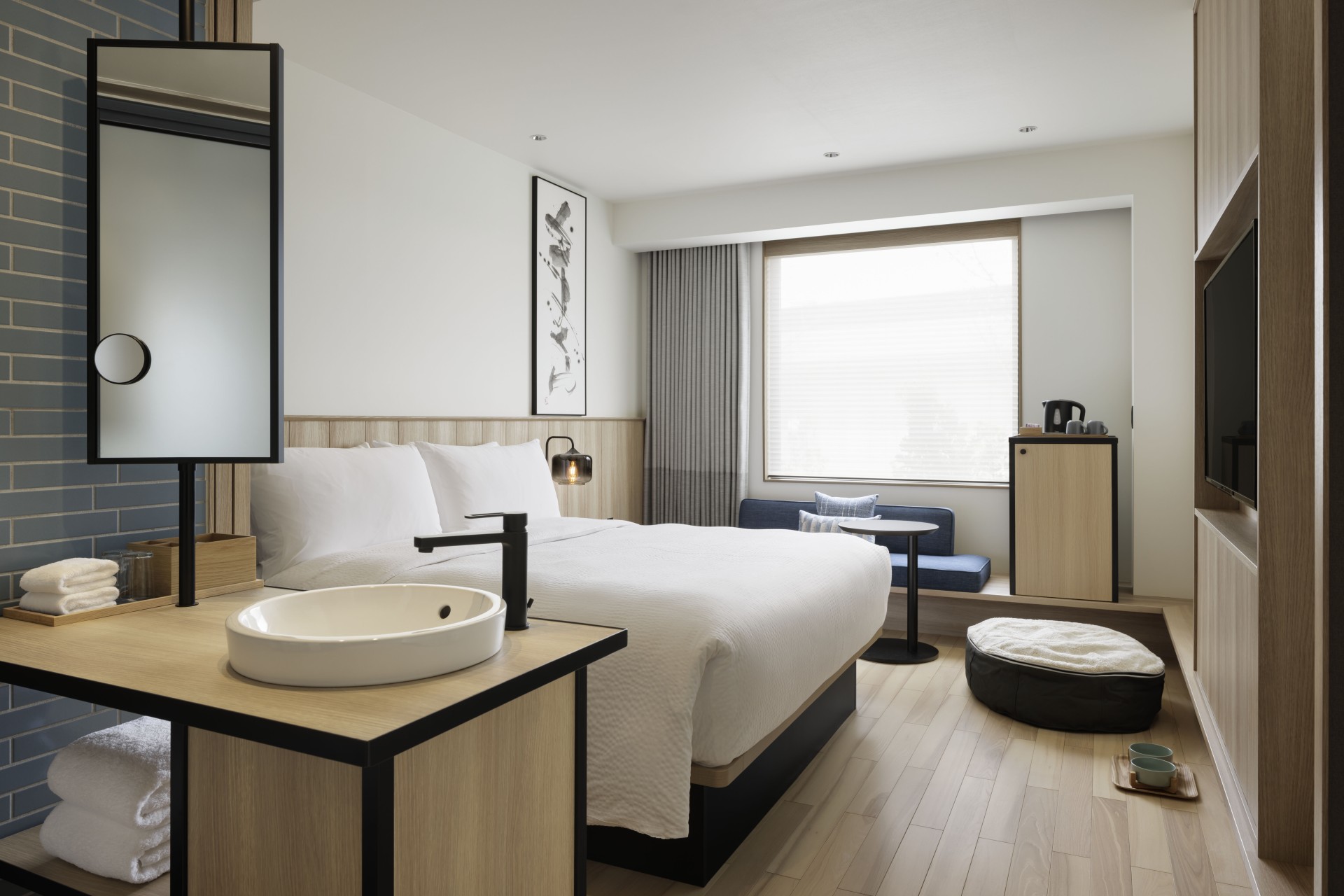a room with a bed and a sink