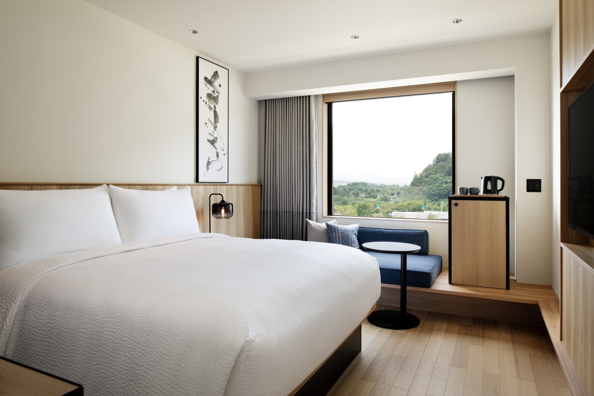 a room with a bed and a window
