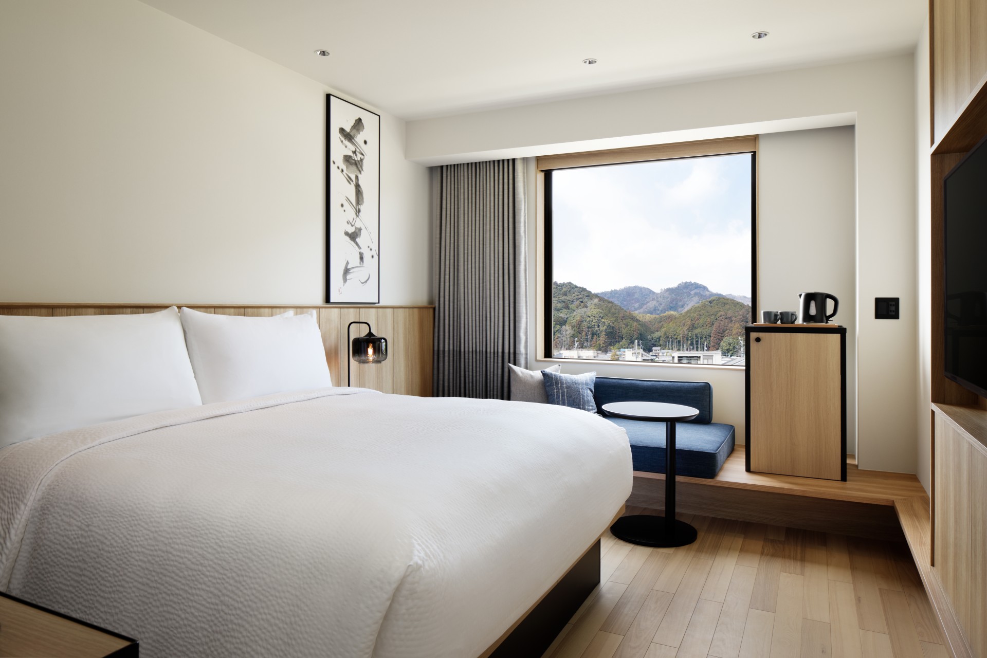 a room with a bed and a window