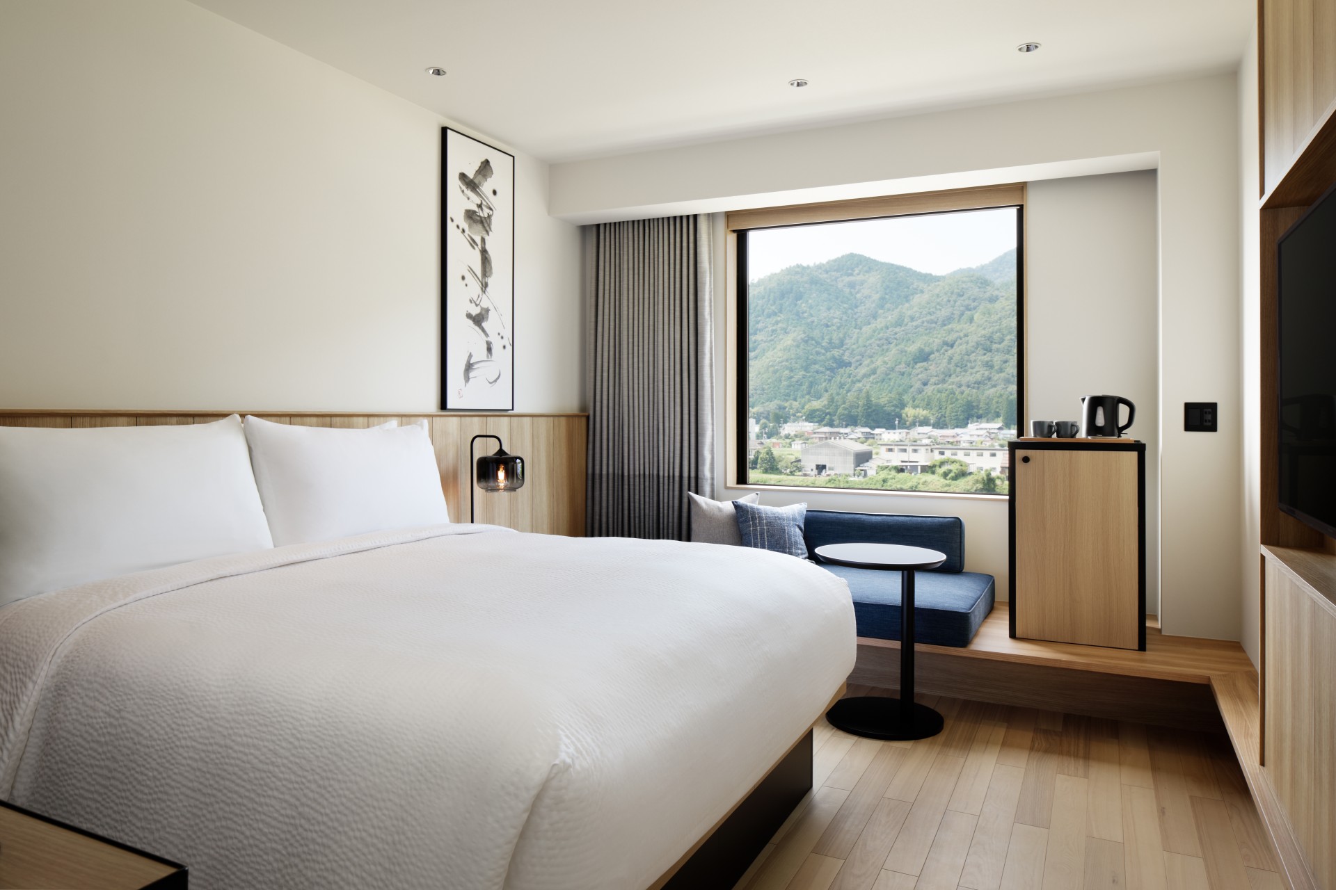 a room with a bed and a window