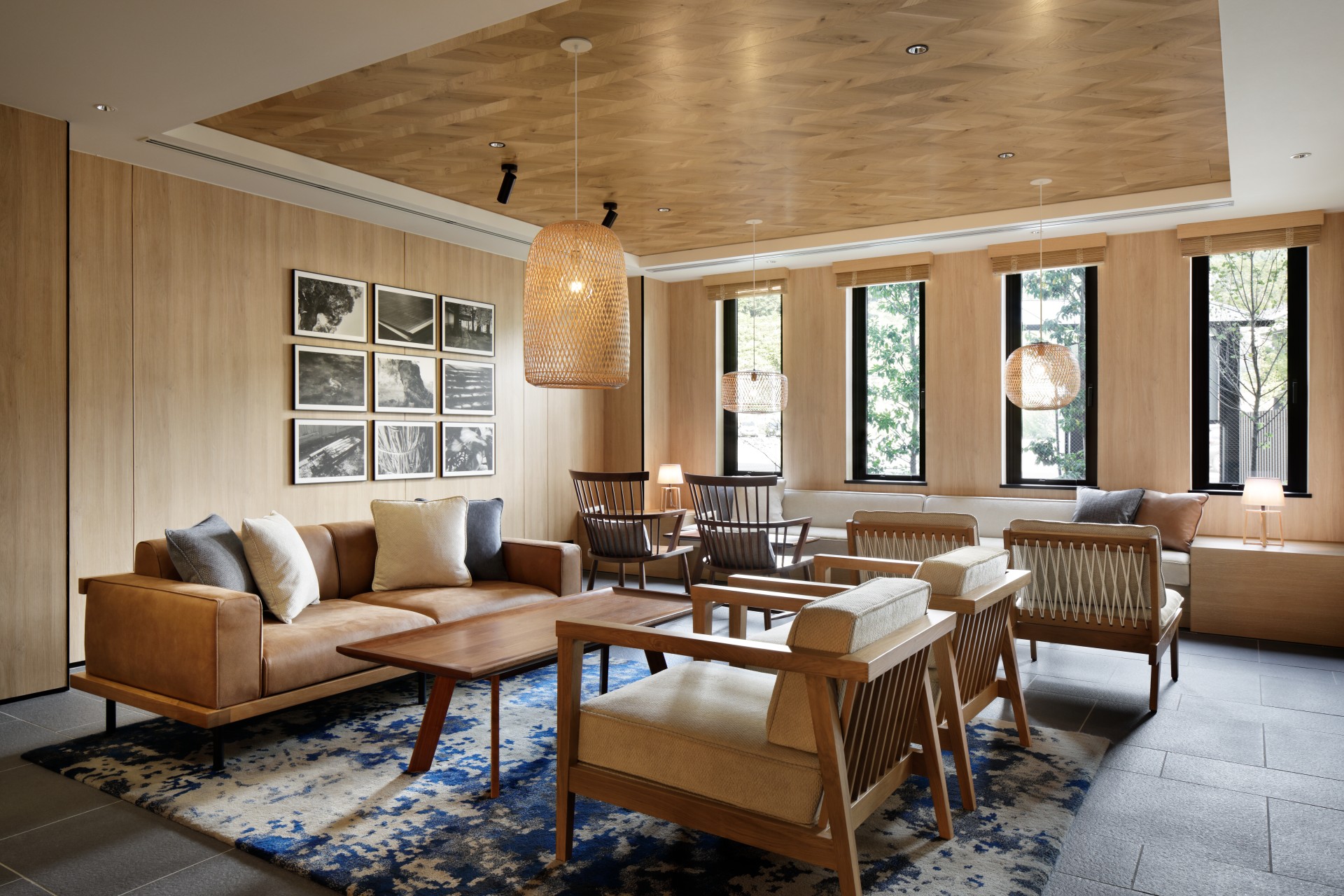 a room with a couch and chairs