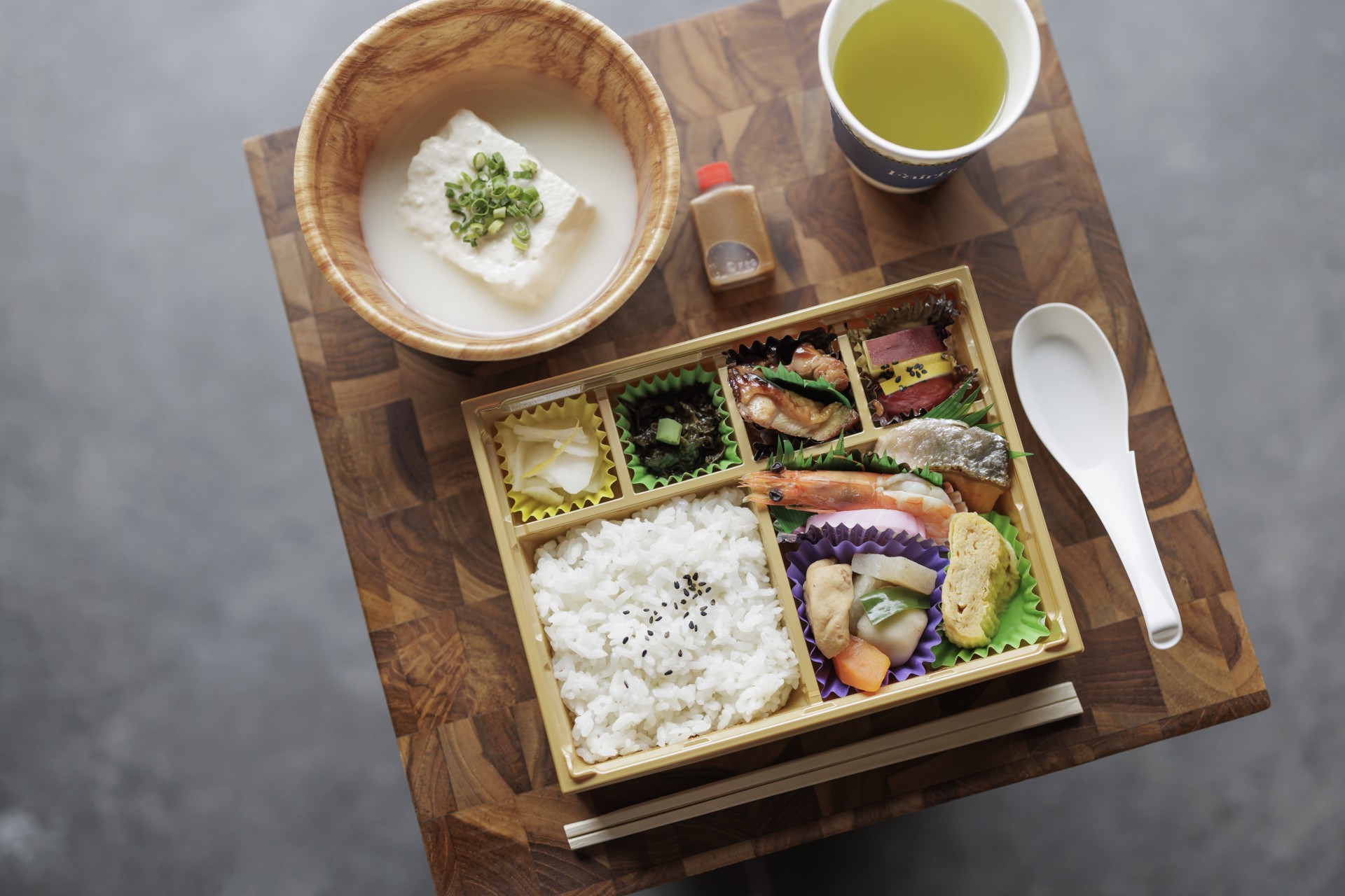 a box of food and a bowl of soup