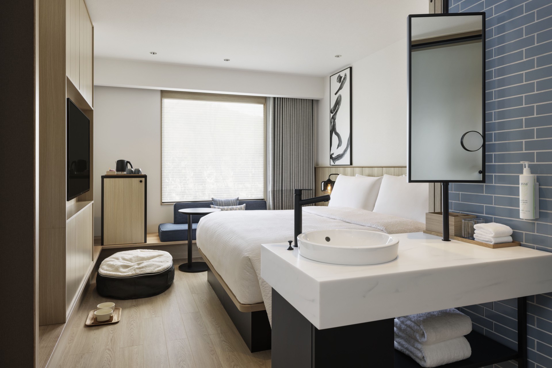 a room with a bed and a sink