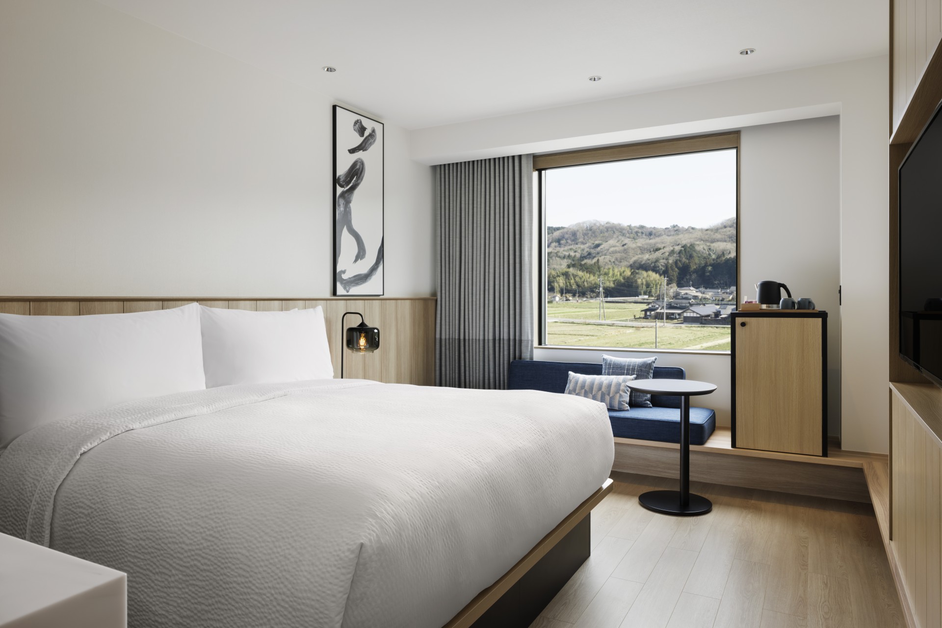 a room with a bed and a window