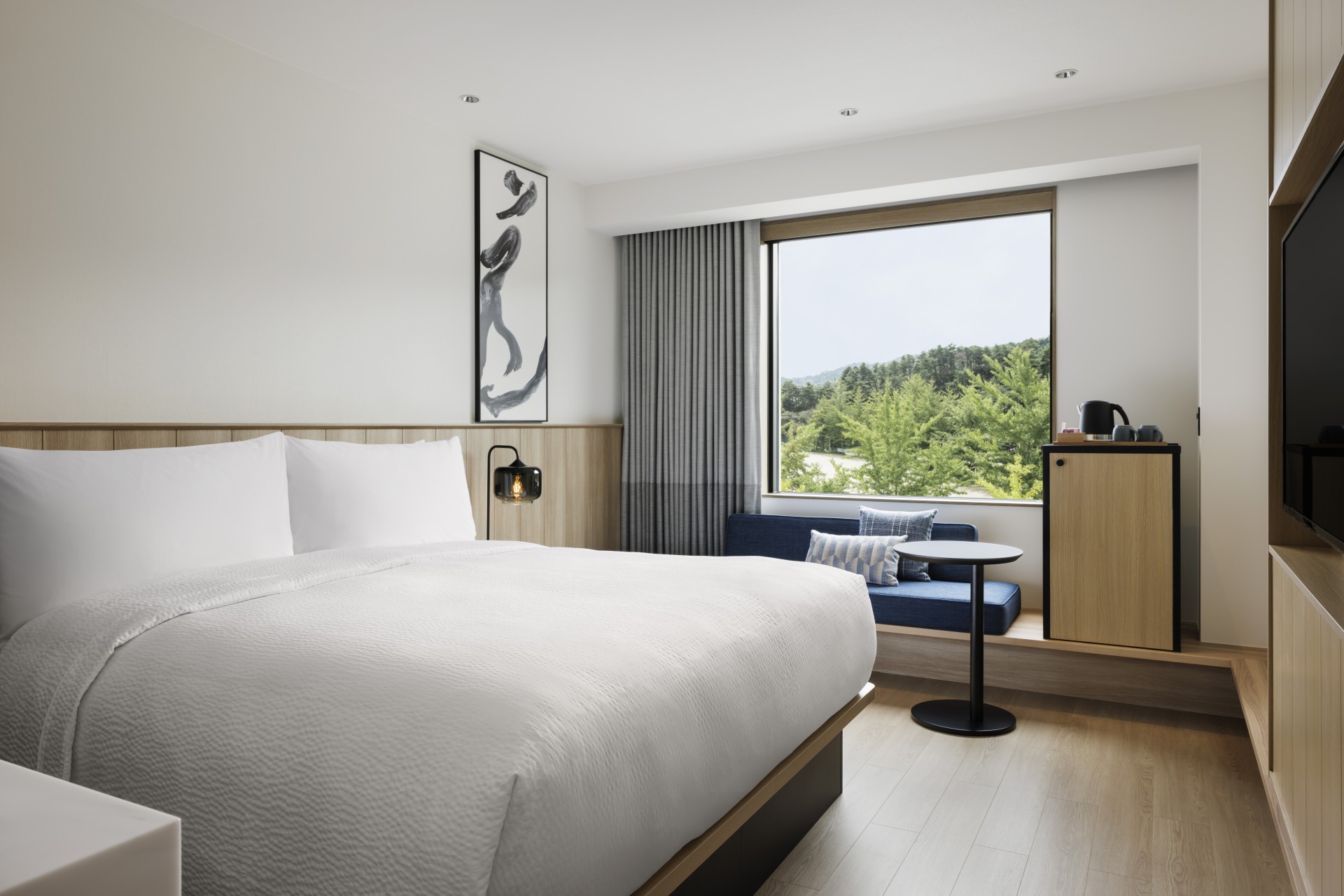 a room with a bed and a window