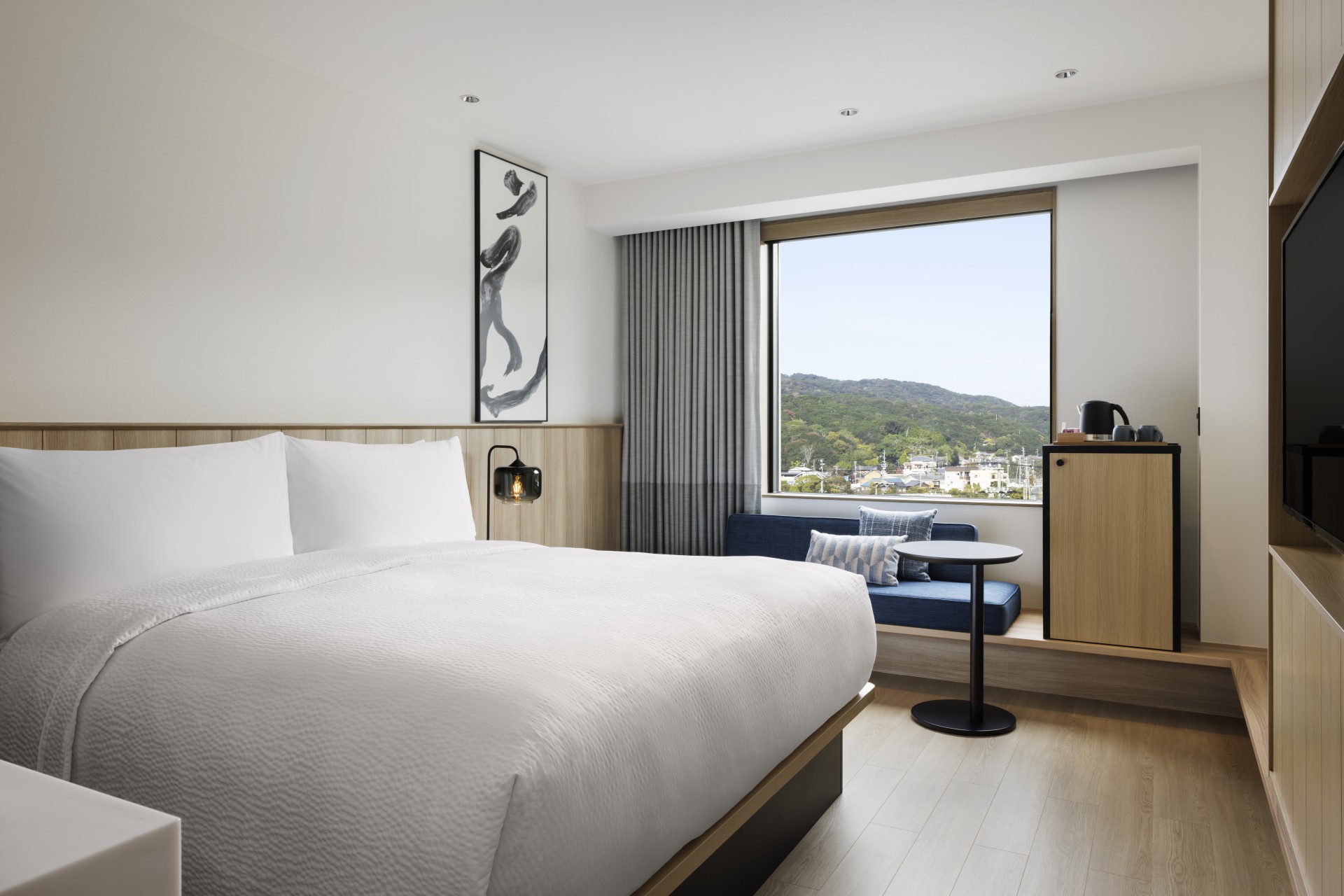 a room with a bed and a window