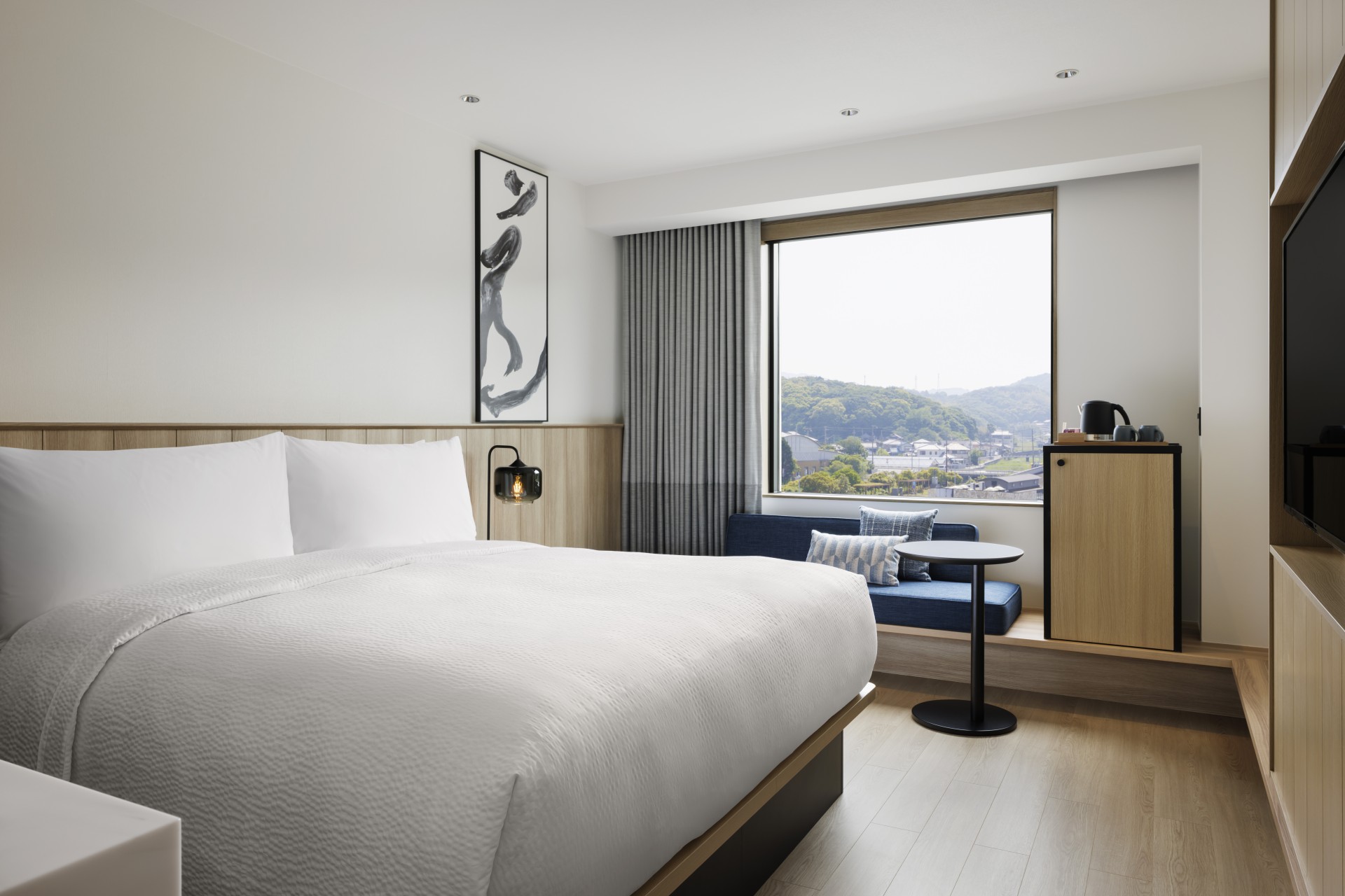 a room with a bed and a window
