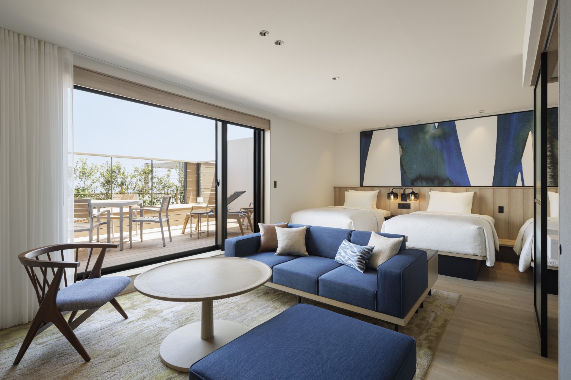 a room with two beds and a couch