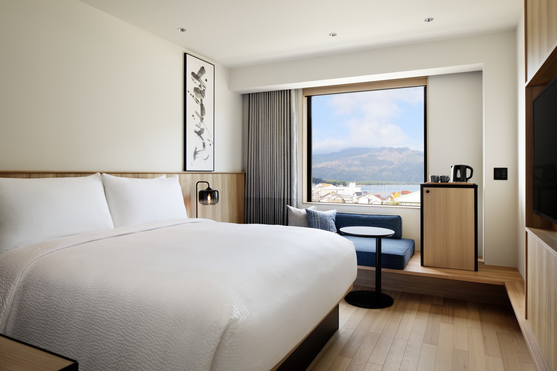 a room with a bed and a window