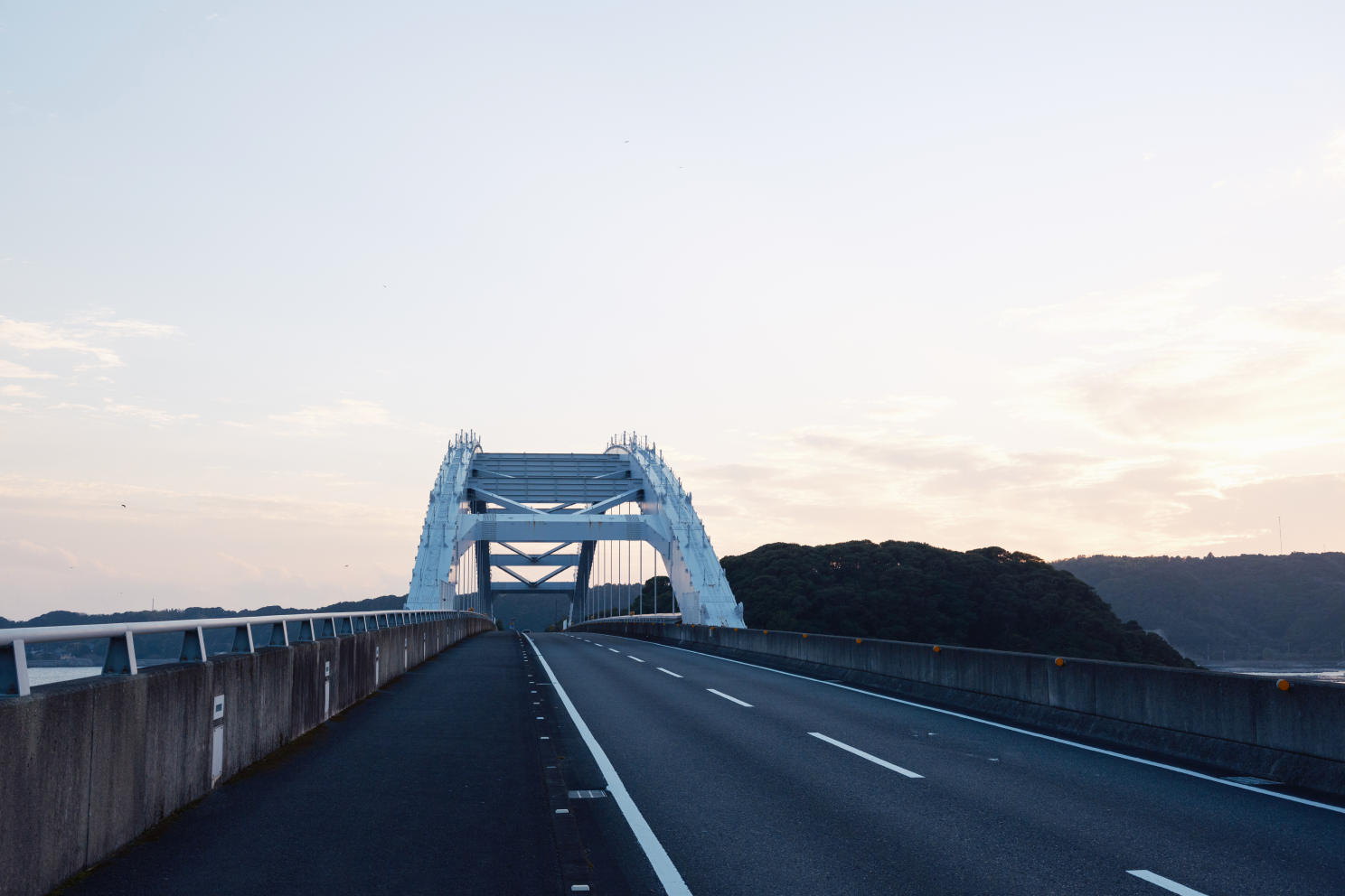 a road with a bridge over it