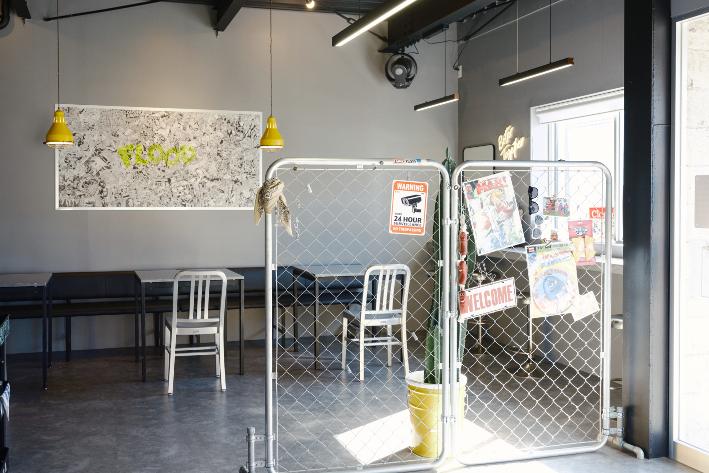 a room with a fence and chairs
