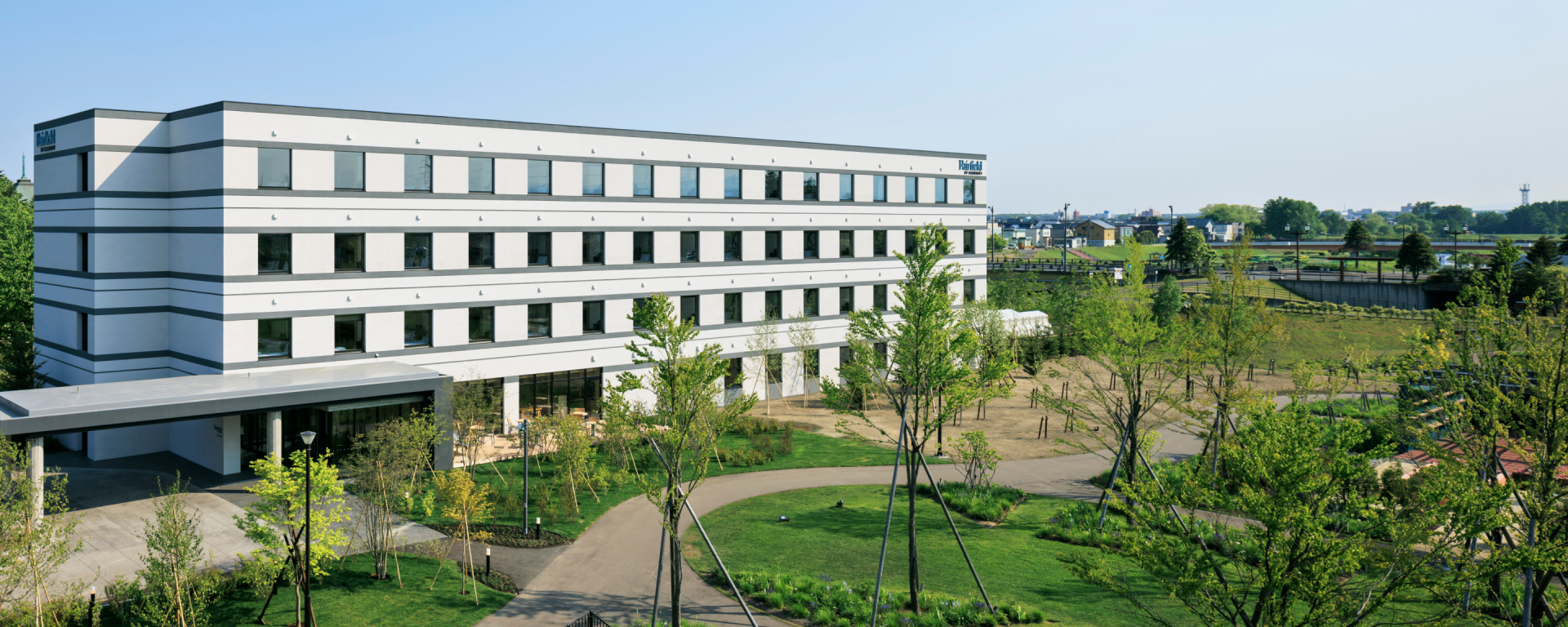 a building with many windows and a path in front of it_Hokkaido Eniwa