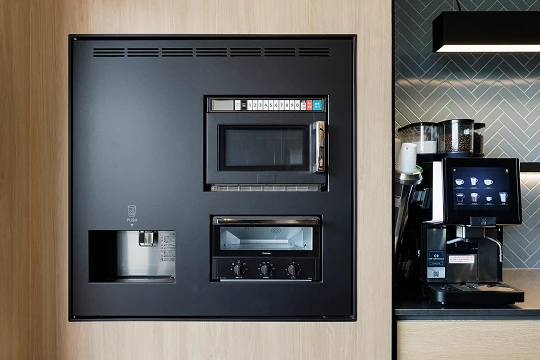 a black microwave oven and a coffee maker