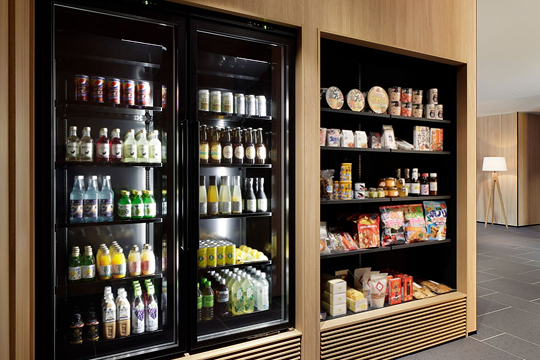 a refrigerator with drinks and snacks