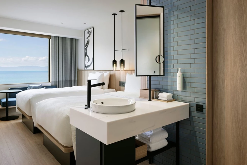 a bathroom with a bed and a sink