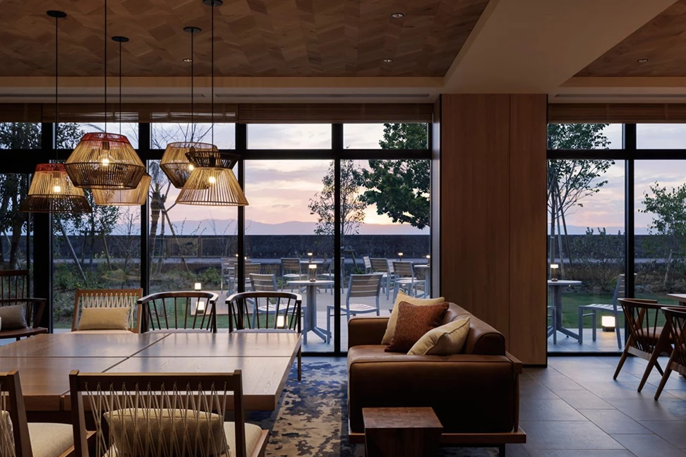 a room with a couch and chairs