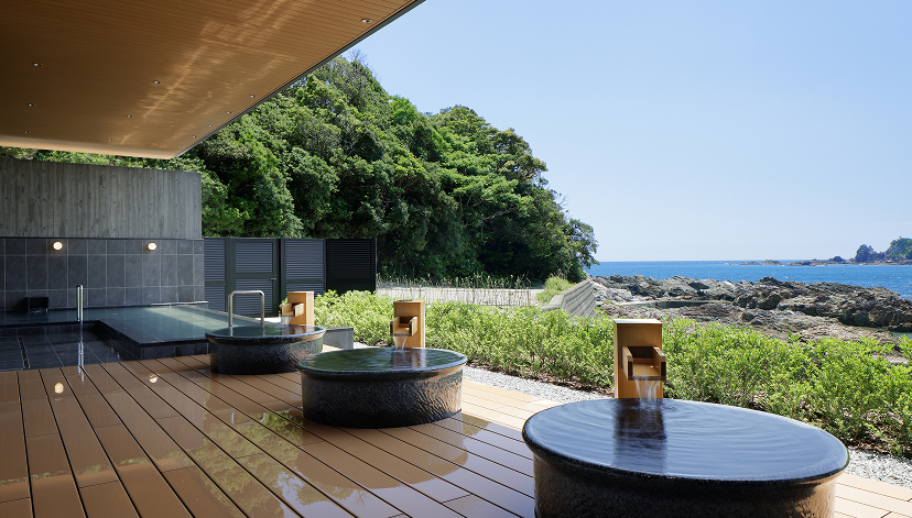 a large outdoor hot tubs with water coming out of it
