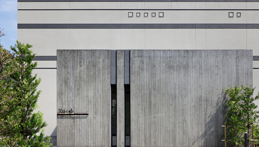 a concrete door with a black door
