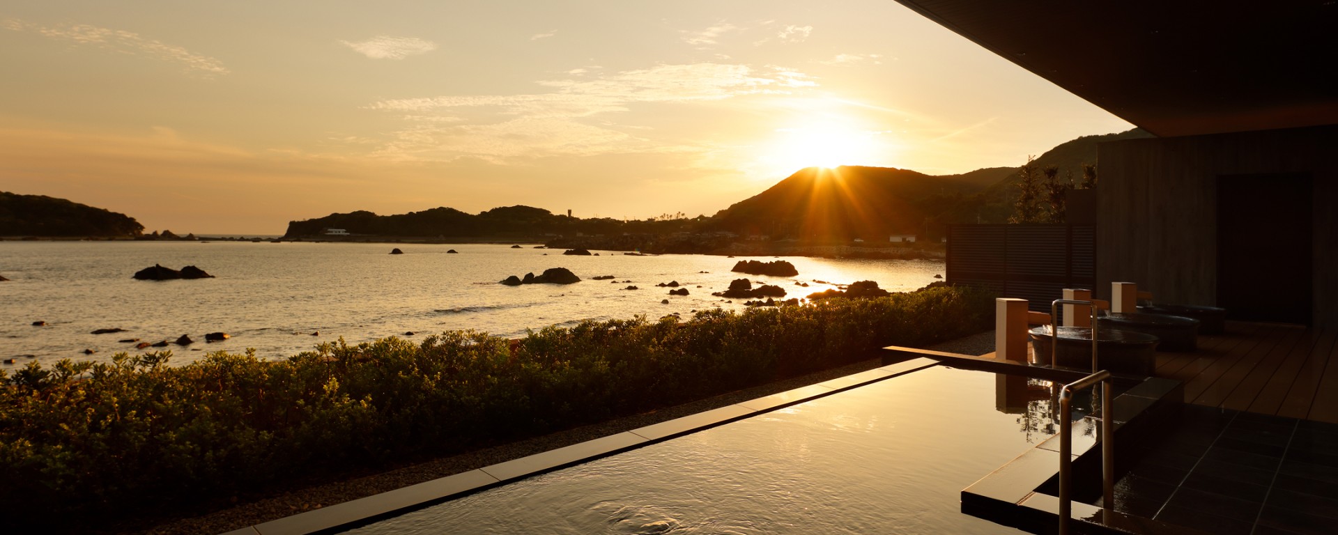 a pool overlooking a body of water