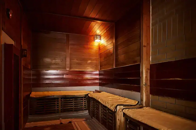 a room with wooden walls and a light