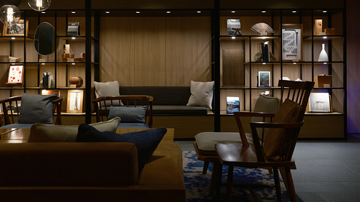 a room with a couch and chairs