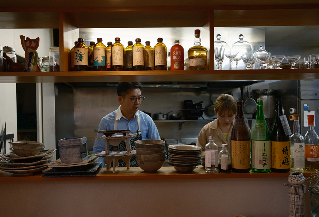 a man and woman behind a counter