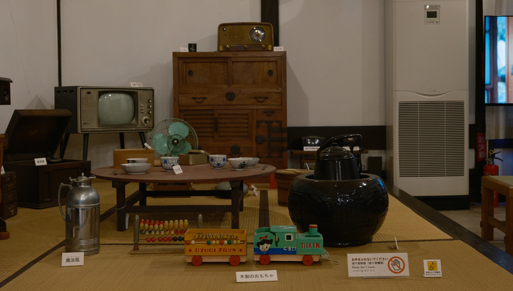 a table with toys and a teapot on it