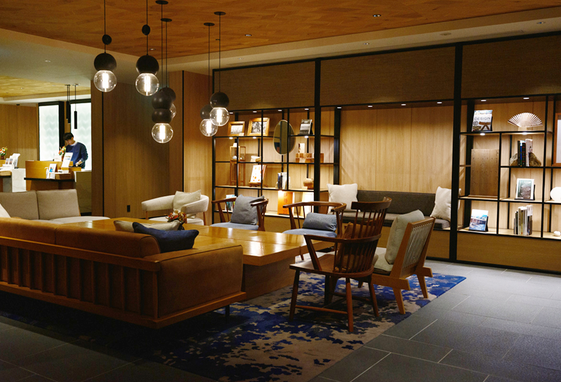a room with a couch and chairs