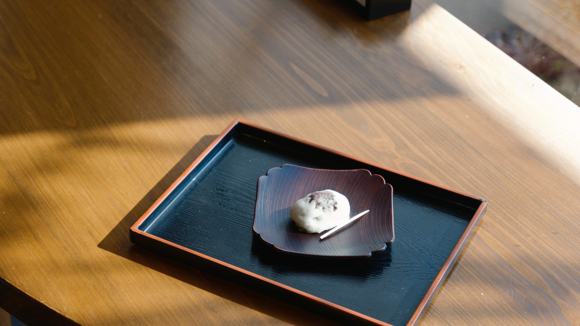 a plate with a piece of food on it
