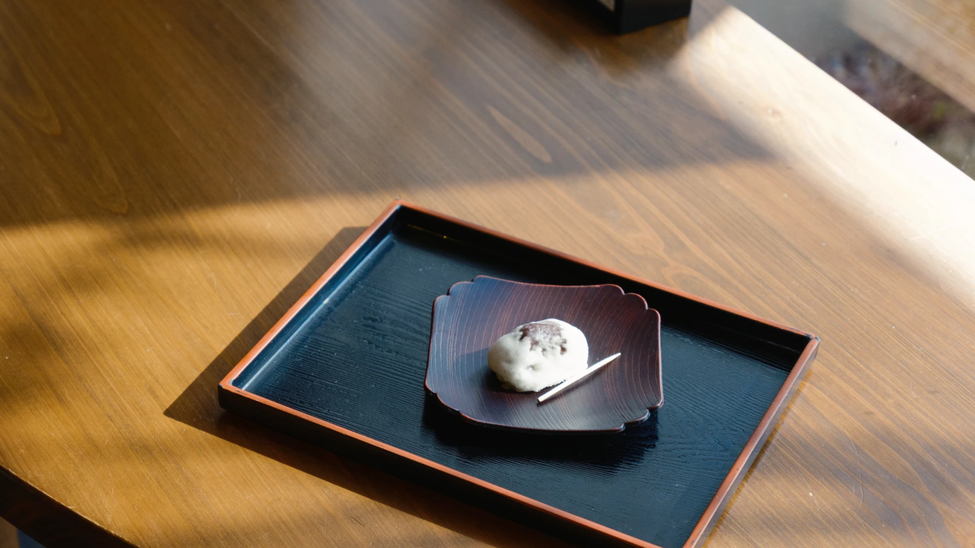 a plate with a piece of food on it