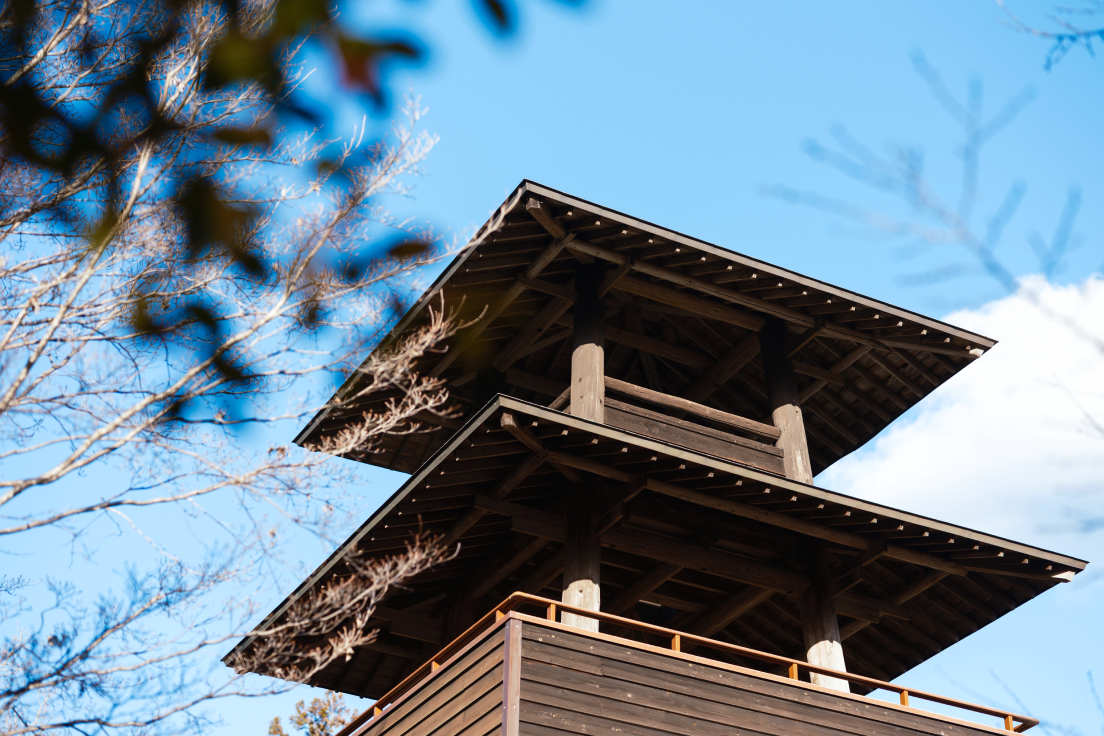a wooden tower with a roof