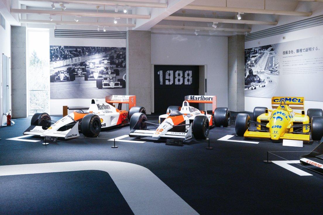 a group of race cars in a room