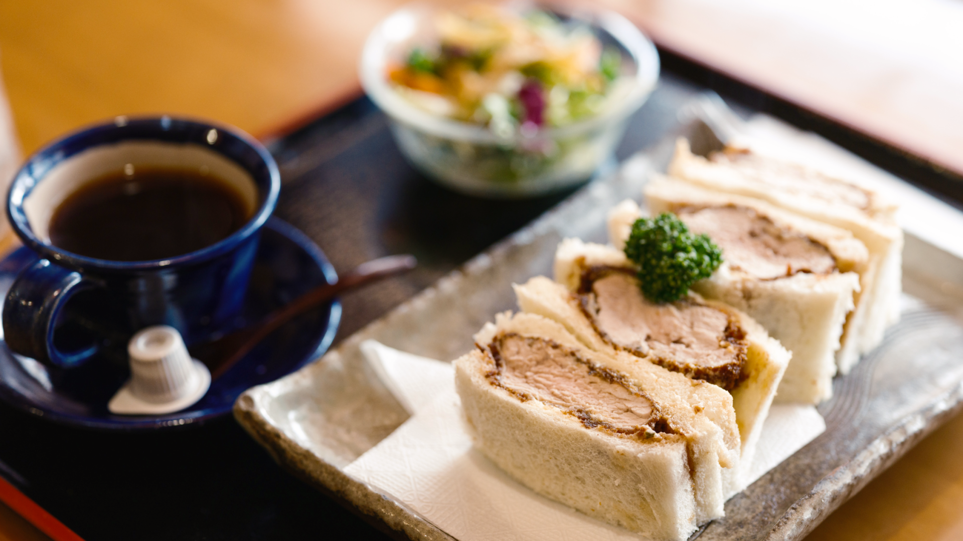 a plate of food and a cup of coffee