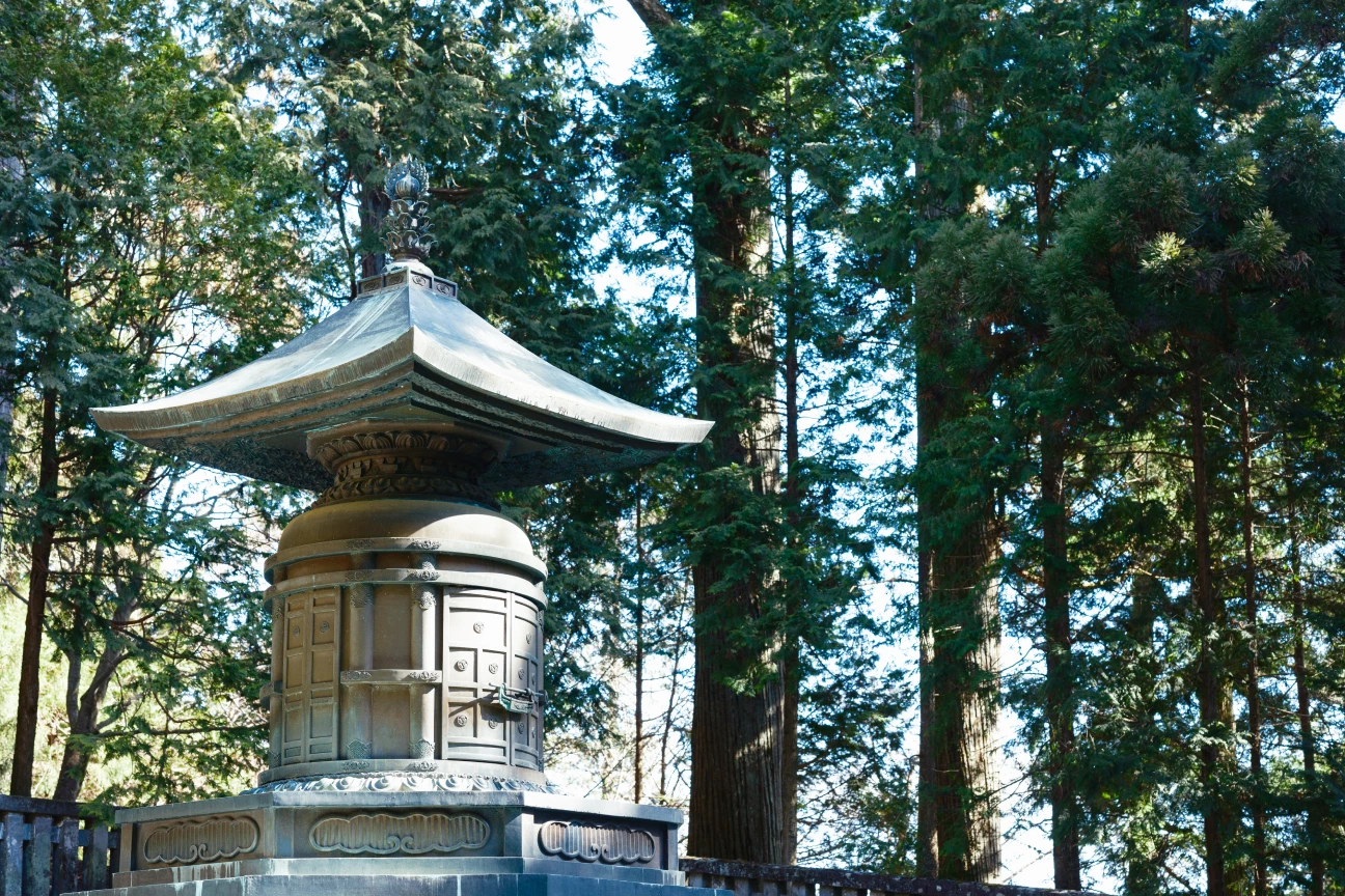 a stone structure with a roof and a roof on top