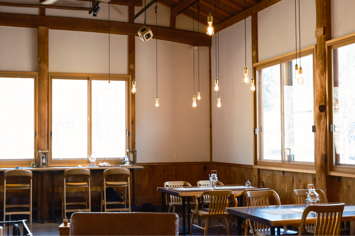 a room with tables and chairs and a table and chairs