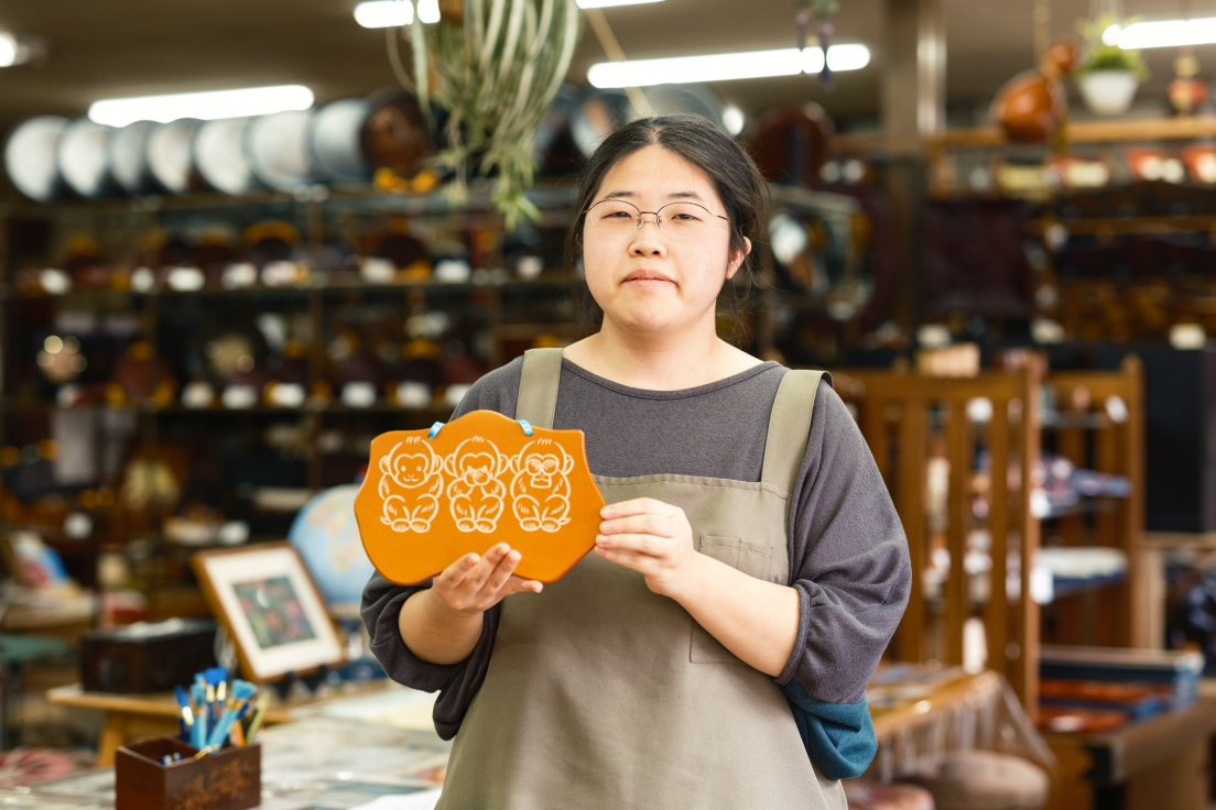 a woman holding a sign