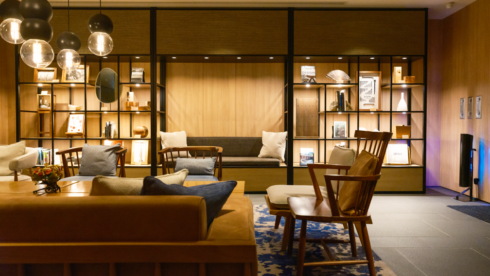 a room with a couch and chairs