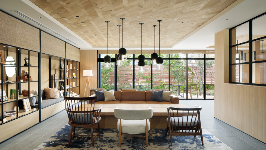 a room with a couch and chairs