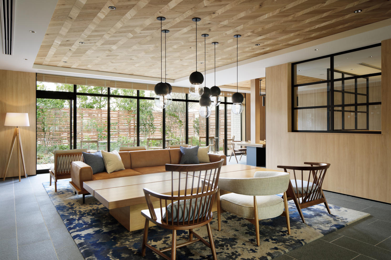 a room with a couch and chairs