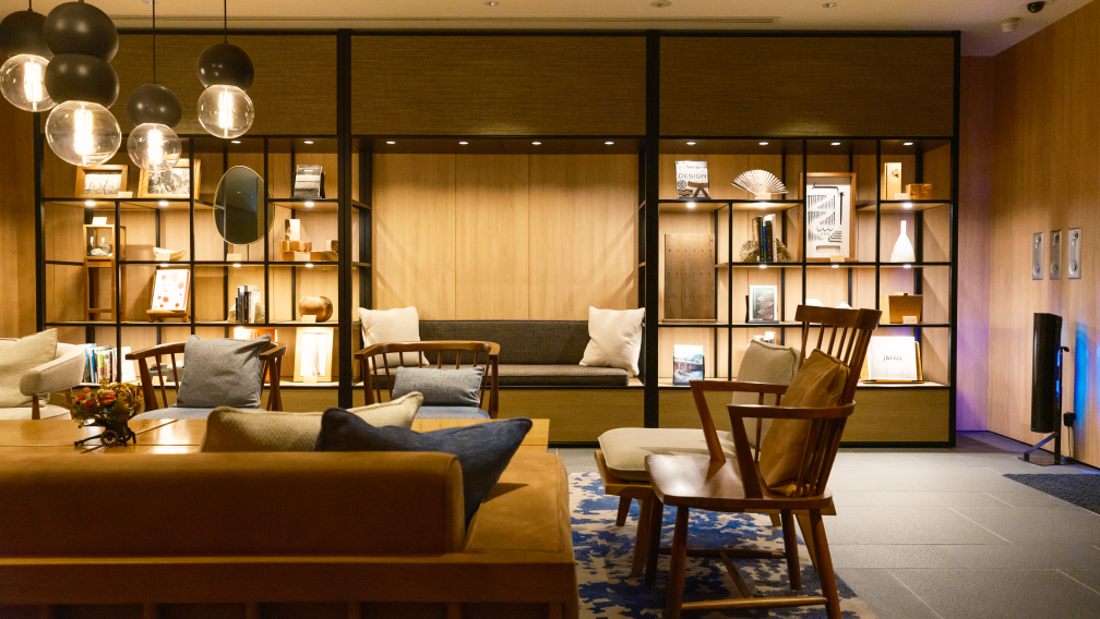 a room with a couch and chairs