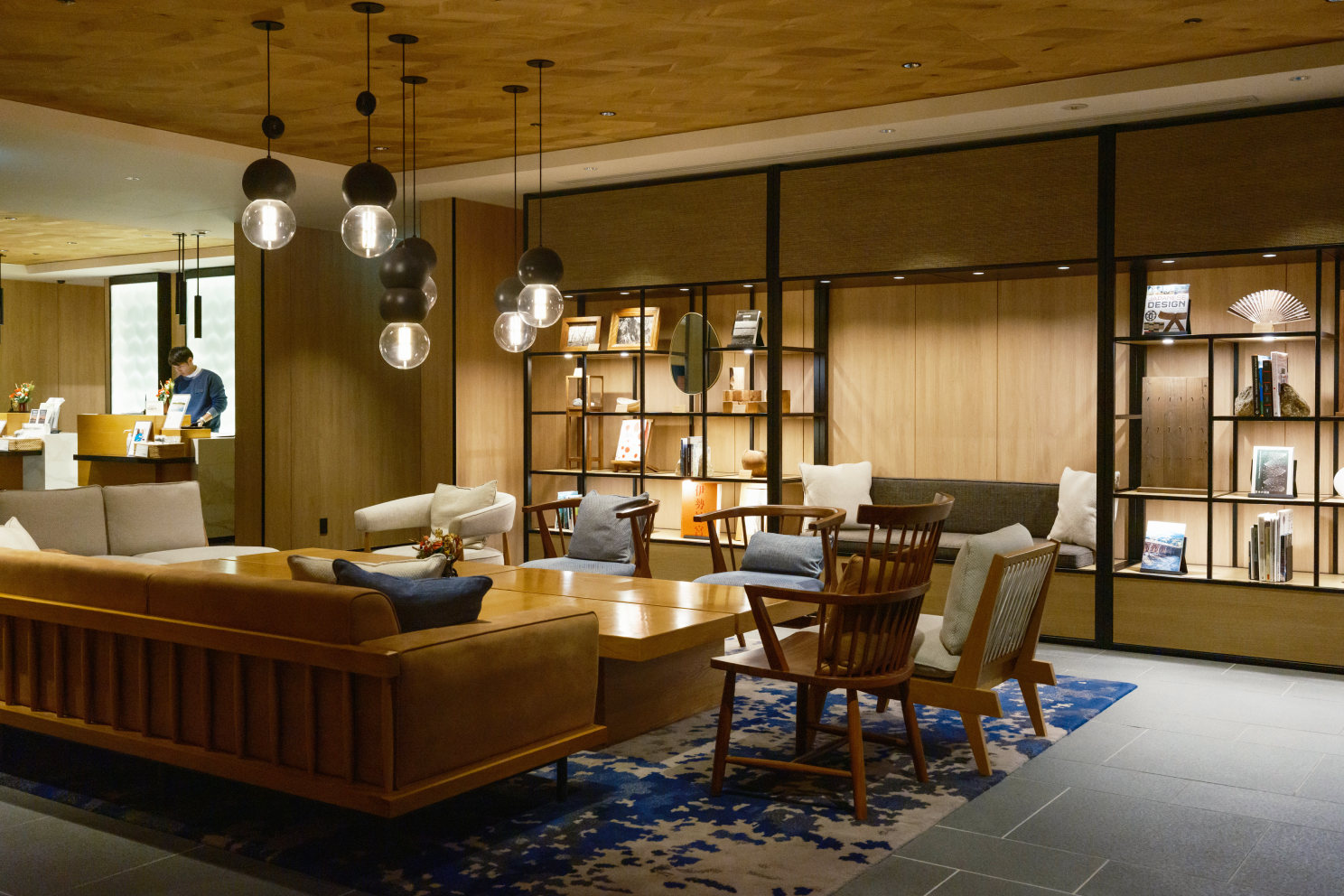 a room with a couch and chairs