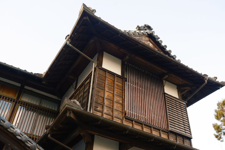 a wooden building with a balcony