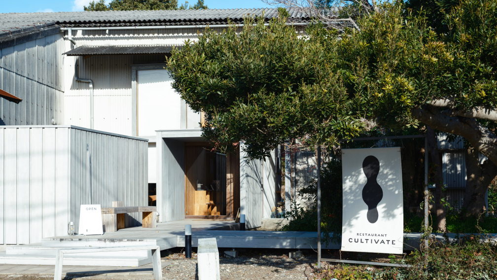 a sign in front of a building